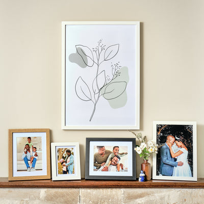Kenro Chester frames on wood shelf and wall with family portraits in