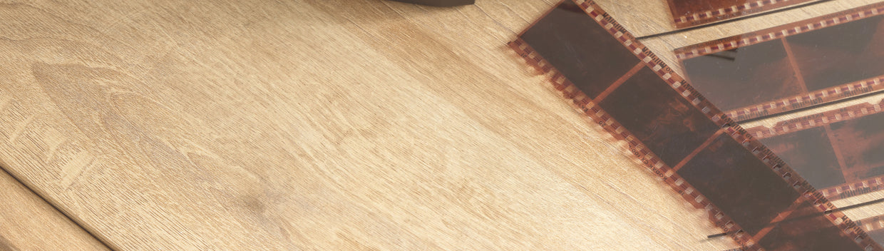 film negative strips on wood table